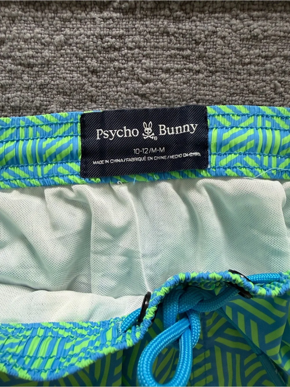 Psycho Bunny Boys’ Swim Trunks & Graphic Tee, and Columbia Rash Guard